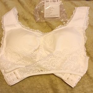 2 Crisscross lift bras new in packages size 2xl . 2 bras white and lavender